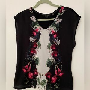 Ted Baker small short sleeved black top with a classic botanical print